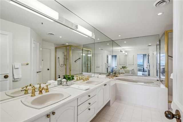 2660 Peachtree Rd NW Unit 23A, Atlanta, GA 30305 - bathroom with a garden tub, double vanity, a stall shower, tile patterned flooring, and recessed lighting