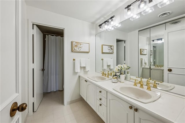 2660 Peachtree Rd NW Unit 23A, Atlanta, GA 30305 - bathroom with double vanity and tile patterned flooring