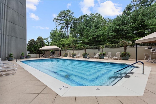 2660 Peachtree Rd NW Unit 23A, Atlanta, GA 30305 - community pool featuring a patio