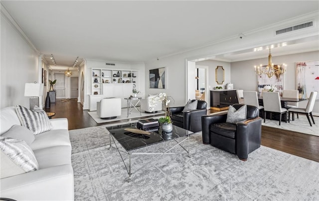 2660 Peachtree Rd NW Unit 23A, Atlanta, GA 30305 - living room featuring wood finished floors, ornamental molding, and a chandelier