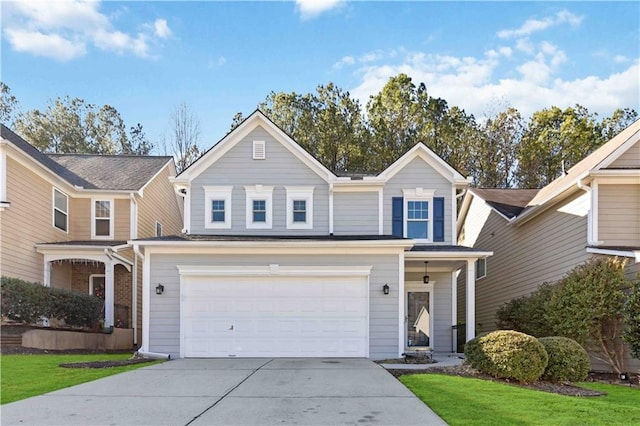 view of front property with a garage and a front lawn