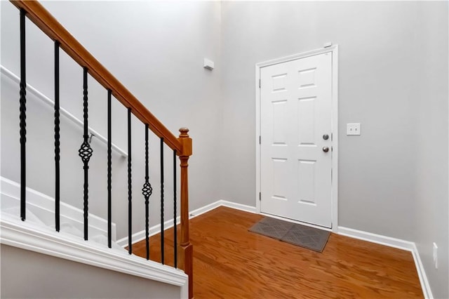 foyer entrance with hardwood / wood-style floors