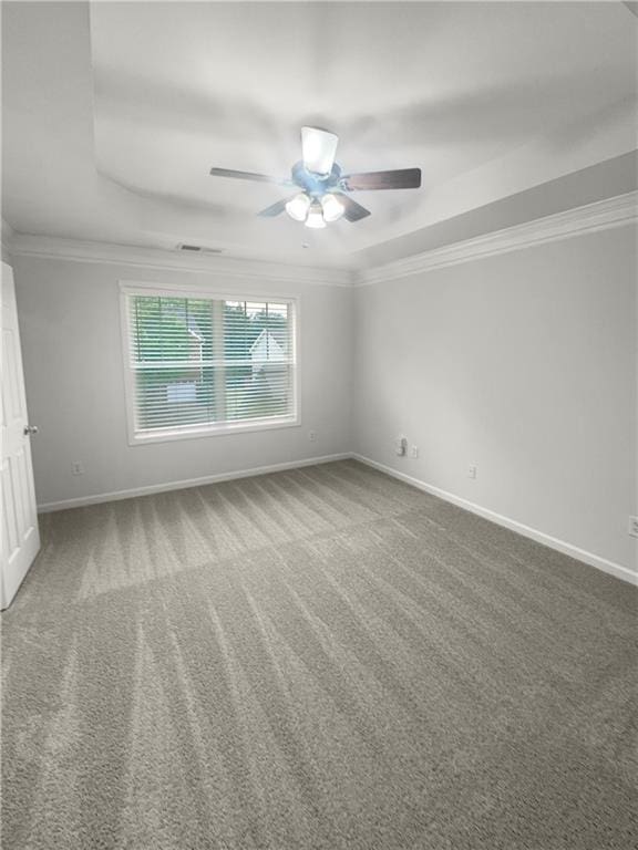 unfurnished room featuring ceiling fan, crown molding, and carpet