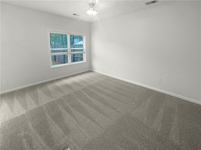 empty room featuring carpet and ceiling fan