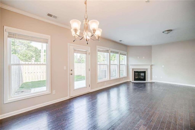 unfurnished living room featuring ornamental molding, a chandelier, and dark hardwood / wood-style floors