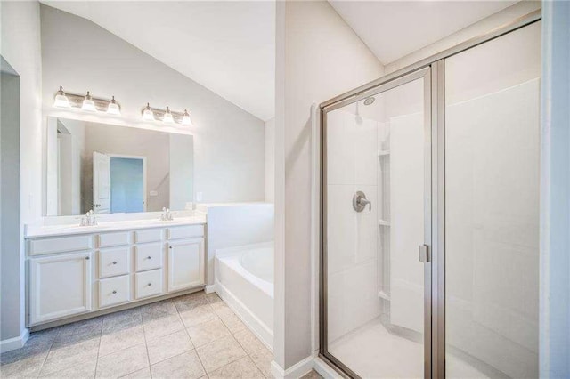 bathroom featuring vanity, vaulted ceiling, plus walk in shower, and tile patterned floors