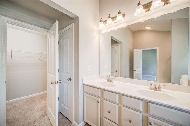 bathroom featuring tile patterned floors and vanity