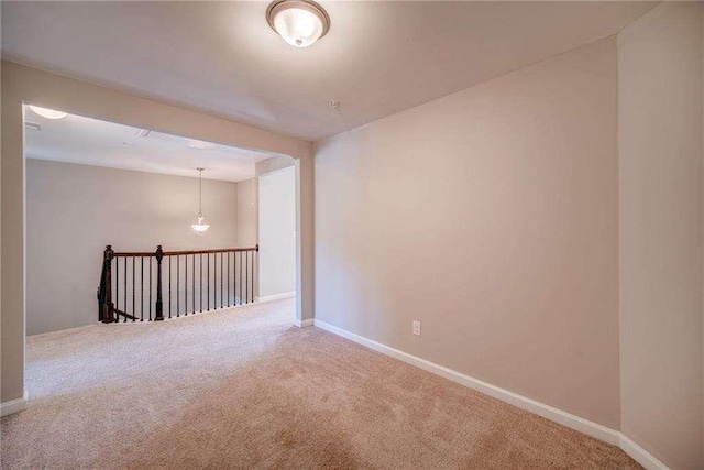 empty room featuring carpet flooring