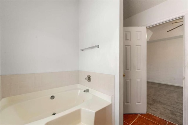 bathroom featuring tile patterned flooring and a bathing tub