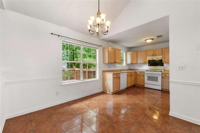 kitchen featuring vaulted ceiling, white appliances, light brown cabinets, decorative light fixtures, and a chandelier