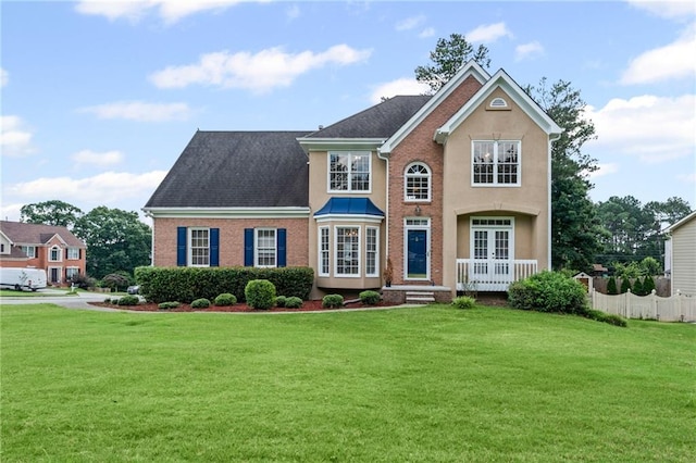 479 Rising Sun Path, Lawrenceville, GA 30043 - view of front facade with french doors, a front lawn, and brick siding