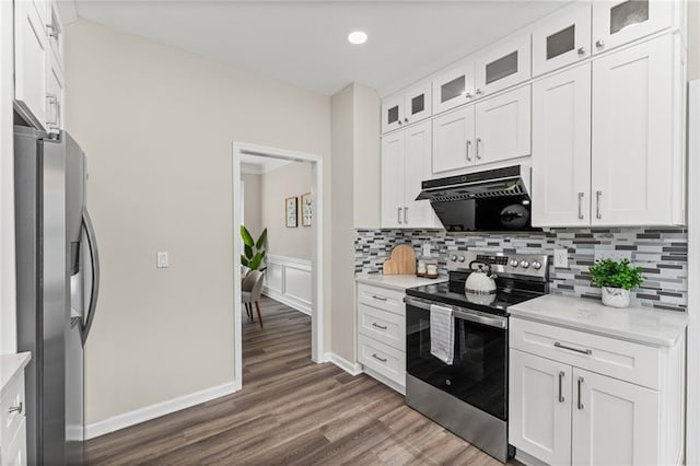 479 Rising Sun Path, Lawrenceville, GA 30043 - kitchen with appliances with stainless steel finishes, backsplash, white cabinets, range hood, and dark wood-style floors