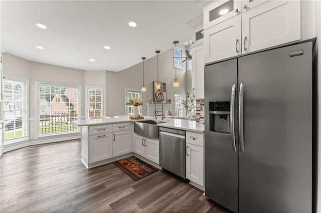 479 Rising Sun Path, Lawrenceville, GA 30043 - kitchen with appliances with stainless steel finishes, a peninsula, white cabinetry, light countertops, and recessed lighting