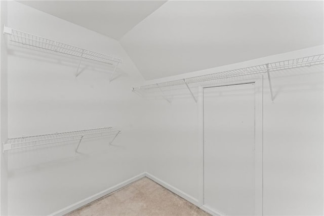 479 Rising Sun Path, Lawrenceville, GA 30043 - spacious closet featuring carpet and vaulted ceiling