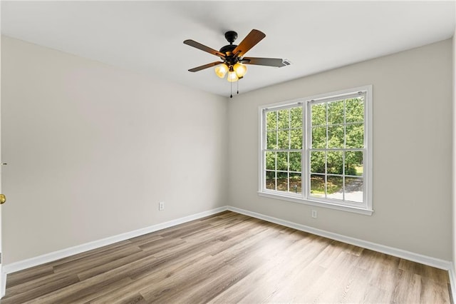 479 Rising Sun Path, Lawrenceville, GA 30043 - empty room with wood finished floors and a ceiling fan