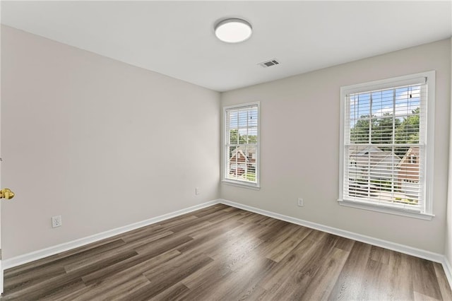 479 Rising Sun Path, Lawrenceville, GA 30043 - spare room featuring wood finished floors and plenty of natural light