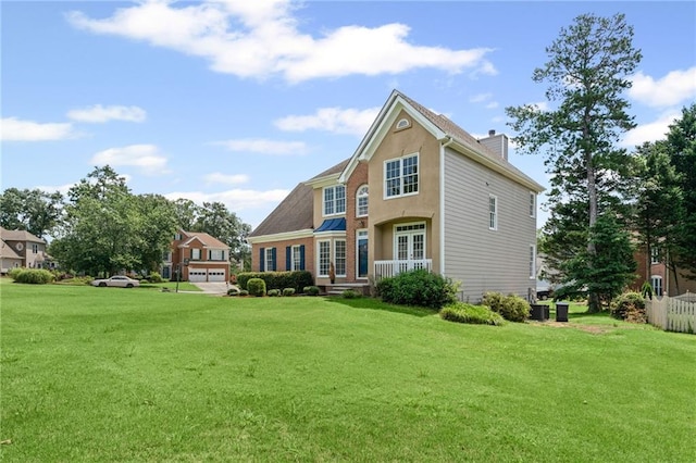 479 Rising Sun Path, Lawrenceville, GA 30043 - back of house with a chimney and a lawn