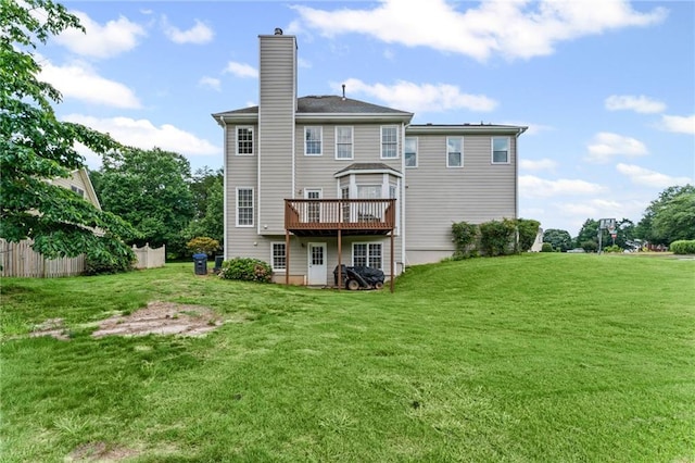 479 Rising Sun Path, Lawrenceville, GA 30043 - back of property with a deck and a chimney