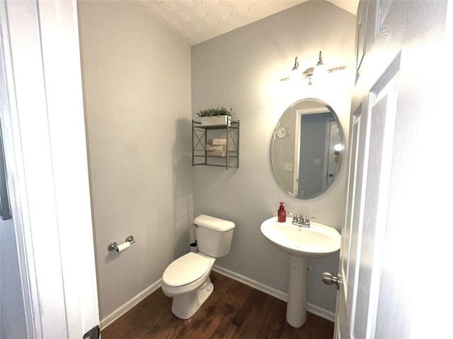 532 Oakside Pl, Acworth, GA 30102 - half bathroom featuring toilet, wood finished floors, baseboards, and a textured ceiling