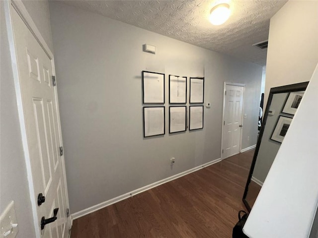 532 Oakside Pl, Acworth, GA 30102 - hallway with wood finished floors, a textured ceiling, and baseboards