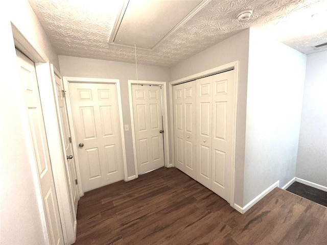 532 Oakside Pl, Acworth, GA 30102 - hallway featuring attic access, dark wood-type flooring, and baseboards