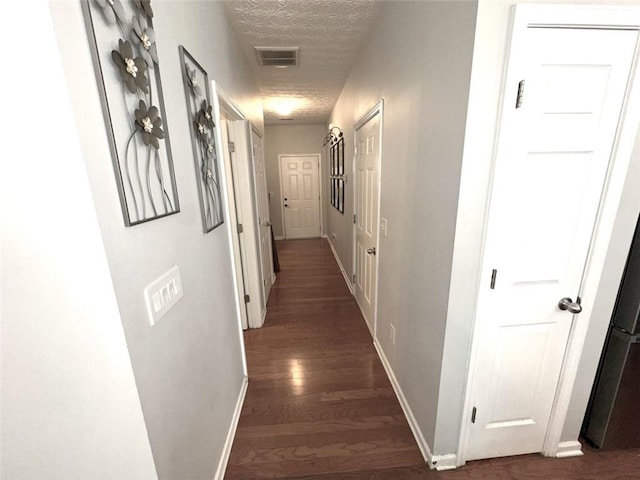 532 Oakside Pl, Acworth, GA 30102 - hallway with dark wood-style flooring, baseboards, and a textured ceiling