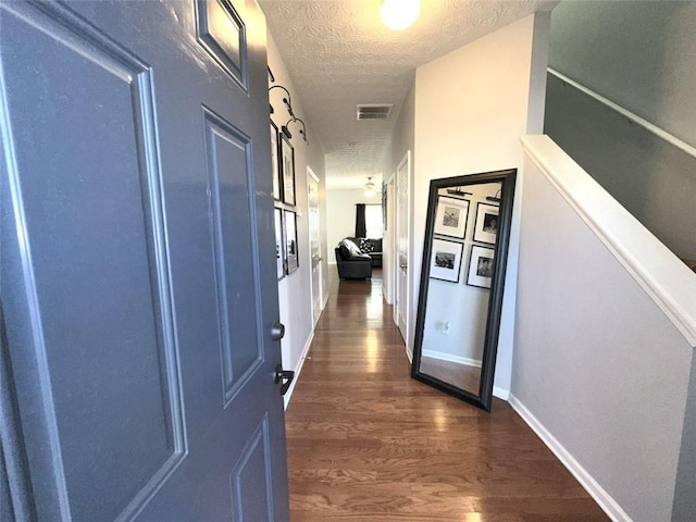 532 Oakside Pl, Acworth, GA 30102 - corridor with a textured ceiling, dark wood-style floors, and baseboards