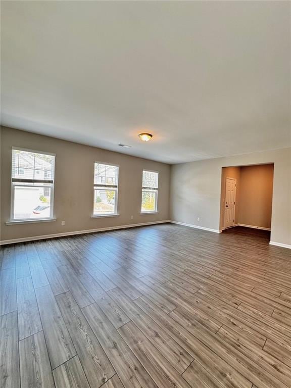 spare room with light hardwood / wood-style floors