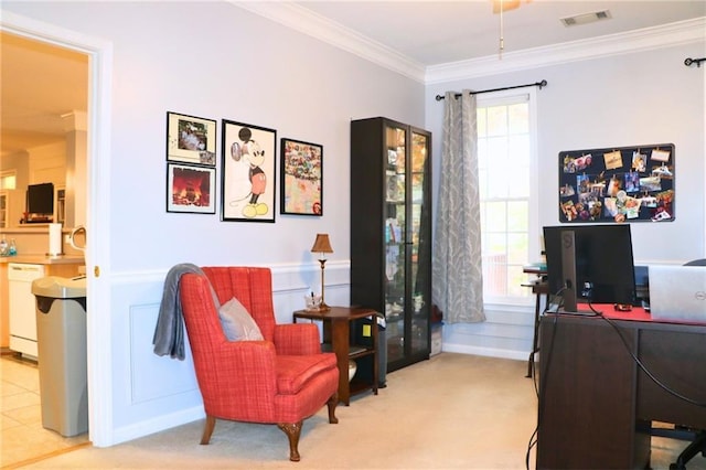 sitting room featuring crown molding, a healthy amount of sunlight, and light carpet