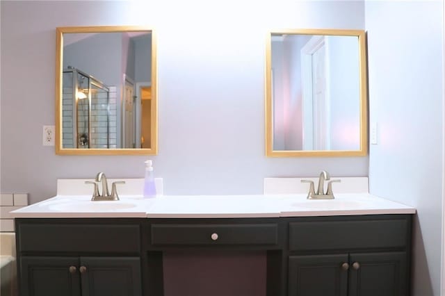 bathroom featuring an enclosed shower and vanity