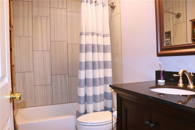 full bathroom featuring shower / bathtub combination with curtain, vanity, and toilet