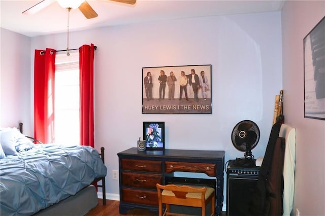 bedroom featuring ceiling fan and dark hardwood / wood-style floors