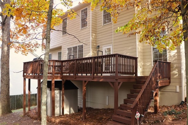 back of property with a wooden deck