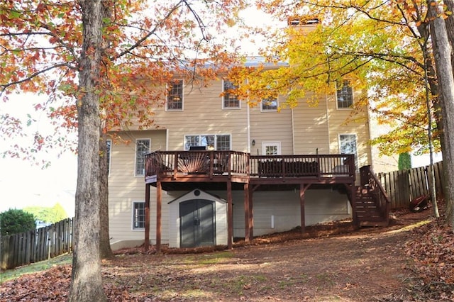 back of property featuring a wooden deck