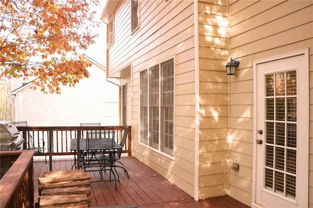 wooden deck featuring grilling area