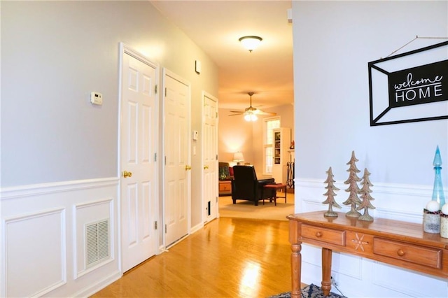 hall with light hardwood / wood-style floors