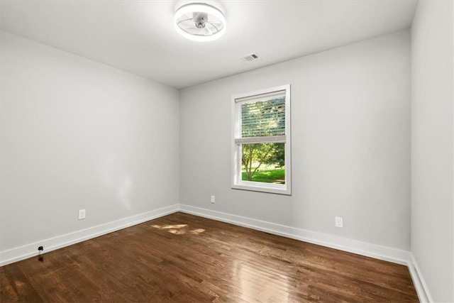 spare room featuring hardwood / wood-style floors