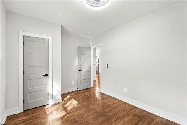 unfurnished bedroom featuring hardwood / wood-style flooring