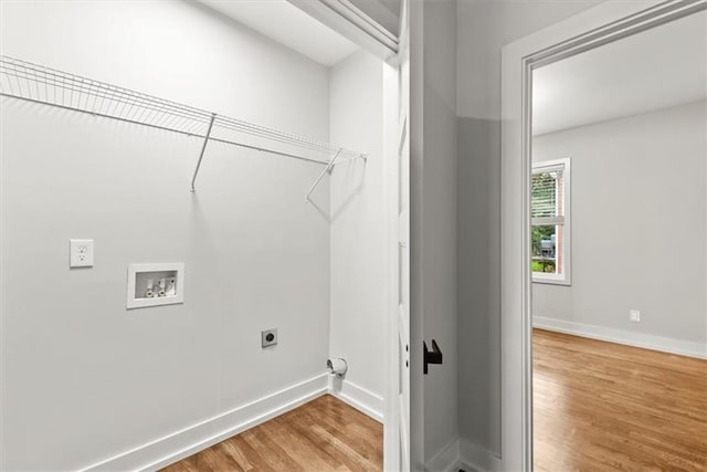 laundry room with hookup for an electric dryer, washer hookup, and hardwood / wood-style flooring