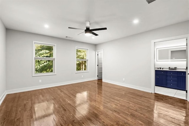 spare room with ceiling fan and light hardwood / wood-style floors