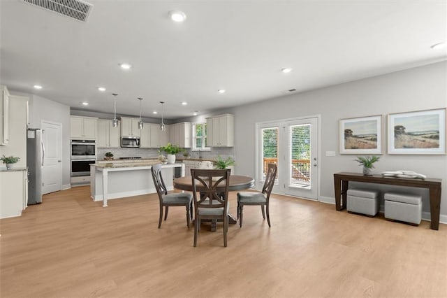 7410 Ansley View Ln, Cumming, GA 30028 - dining area featuring light wood-style flooring and recessed lighting