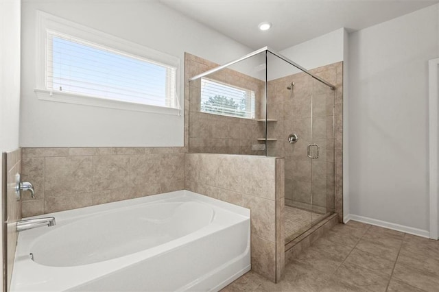7410 Ansley View Ln, Cumming, GA 30028 - bathroom featuring a garden tub and a shower stall