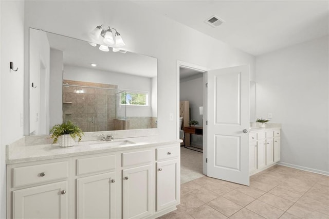 7410 Ansley View Ln, Cumming, GA 30028 - bathroom featuring vanity, a stall shower, tile patterned floors, and ensuite bathroom