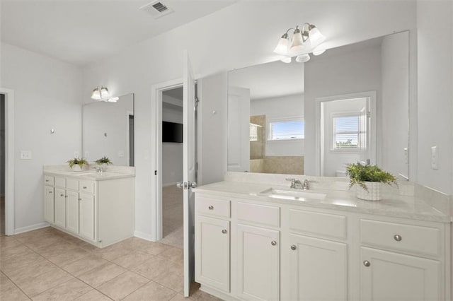 7410 Ansley View Ln, Cumming, GA 30028 - full bath with two vanities, tile patterned flooring, and a tile shower