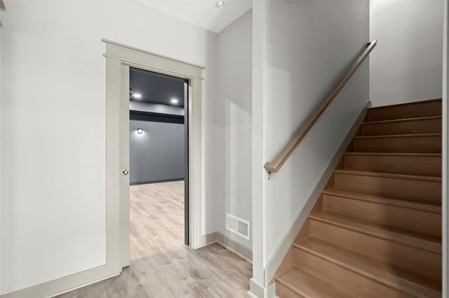 7410 Ansley View Ln, Cumming, GA 30028 - stairway featuring wood finished floors and baseboards