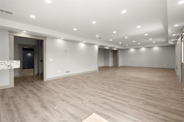7410 Ansley View Ln, Cumming, GA 30028 - below grade area with light wood-style flooring and recessed lighting
