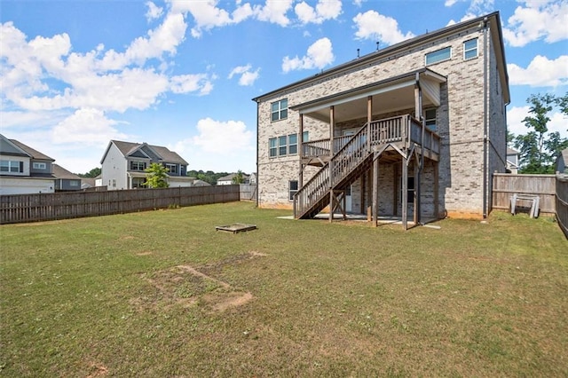 7410 Ansley View Ln, Cumming, GA 30028 - rear view of house with stairs, a fenced backyard, a deck, and brick siding