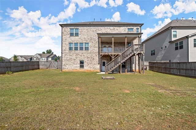 7410 Ansley View Ln, Cumming, GA 30028 - back of house featuring stairway, a fenced backyard, a wooden deck, and brick siding