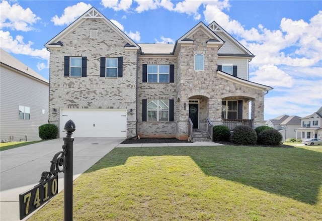 7410 Ansley View Ln, Cumming, GA 30028 - view of front of home featuring concrete driveway, a front lawn, an attached garage, and covered porch