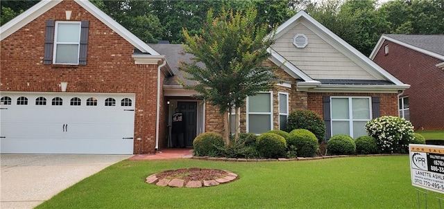 999 Simonton Glen Dr, Lawrenceville, GA 30045 - view of front of home featuring driveway, a front lawn, a garage, and brick siding